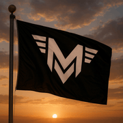 Black and white Mericana M icon flag flying in the sky as sun sets